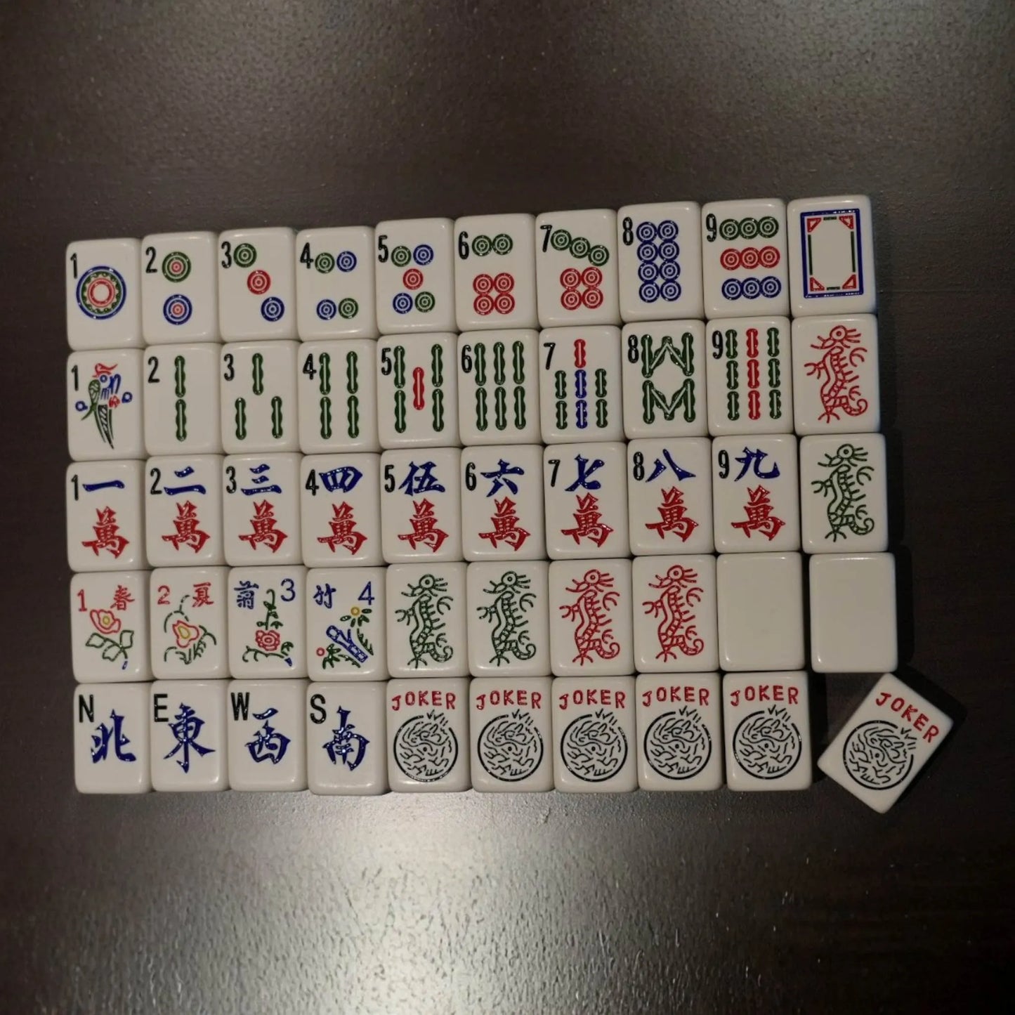 Complete set of 36mm automatic mahjong tiles arranged by suits, winds, and jokers