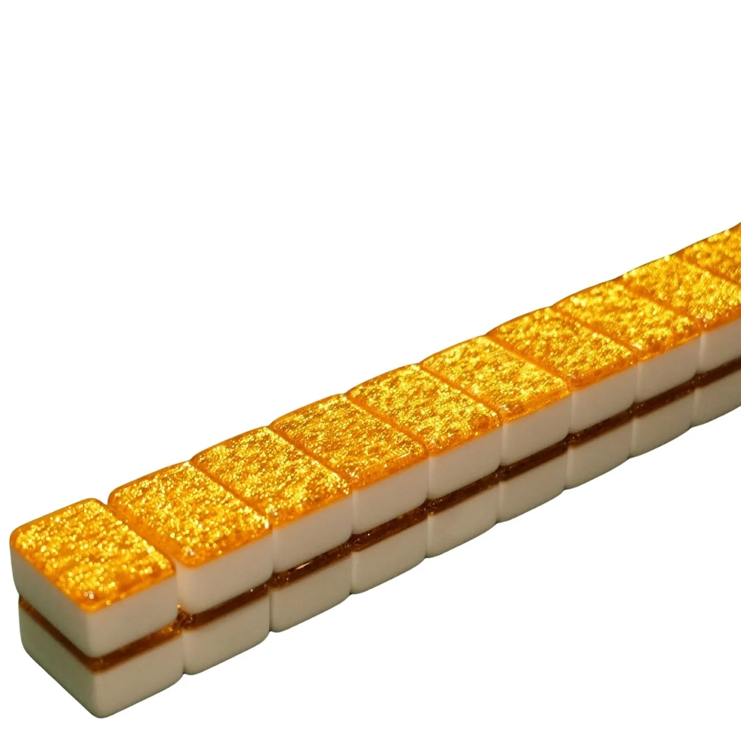 Row of gold and white rectangular tiles on a white background