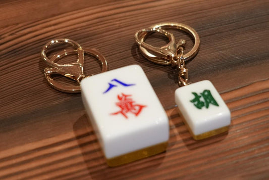 Wooden and acrylic American Mah Jongg racks compared side by side