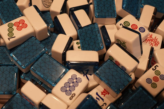 Mah Jongg accessory pouch arranged beside game pieces on a green table