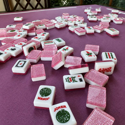 Pink Sparkling Mahjong tiles on a purple table with 'Joker' tiles included.