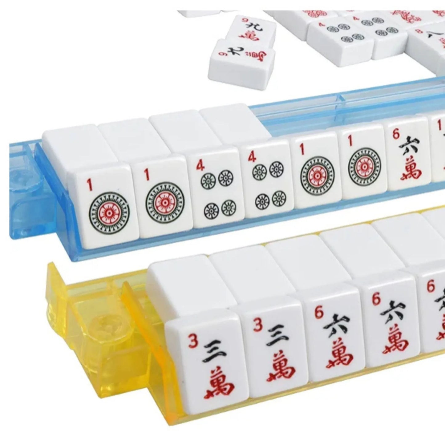 Close-up of white engraved American mahjong tiles arranged in blue and yellow all in one rack and pusher sets
