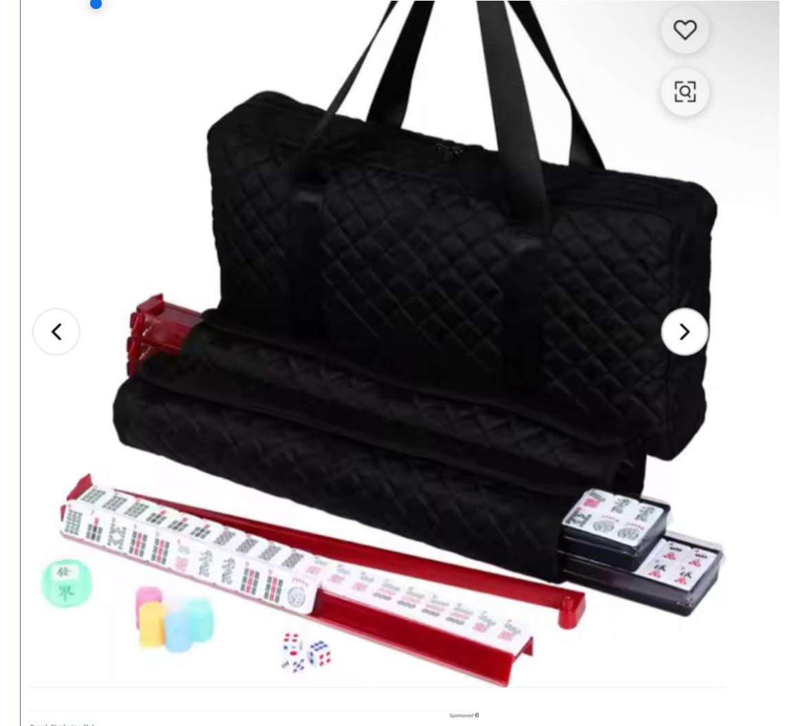 Black quilted bag with red and white game pieces on a white background