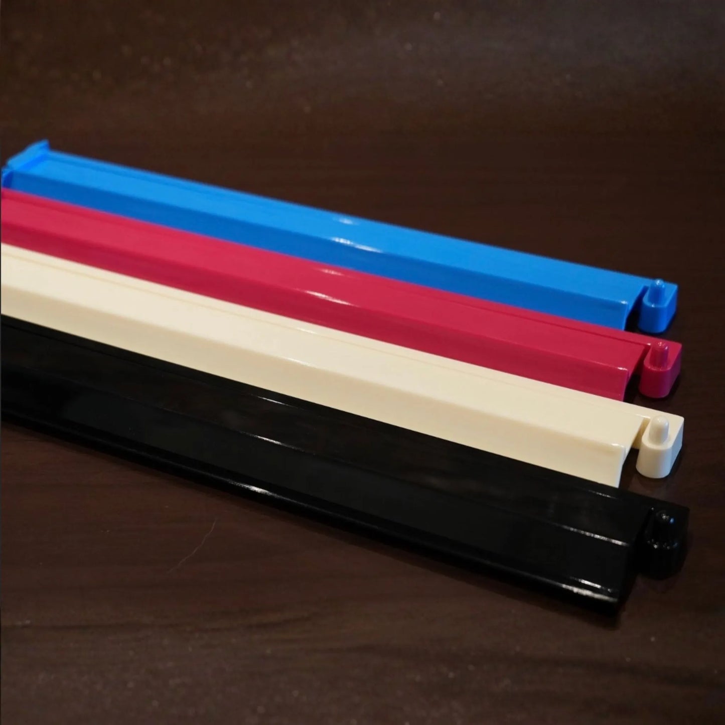 black , blue, pink and white Charleston Club mah jongg tile pusher for clean and consistent tile setup