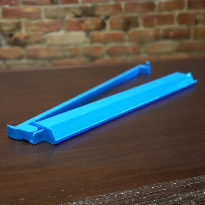 Blue Charleston Club mah jongg tile pusher for smooth tile alignment