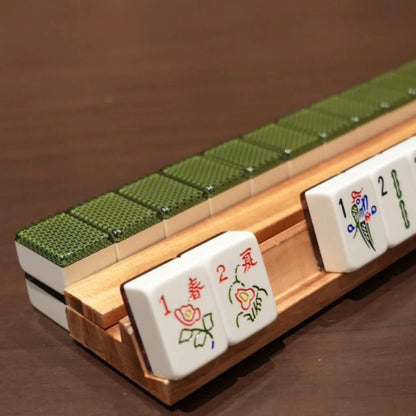 Chelsea green 36mm automatic mahjong tiles arranged on a wooden rack
