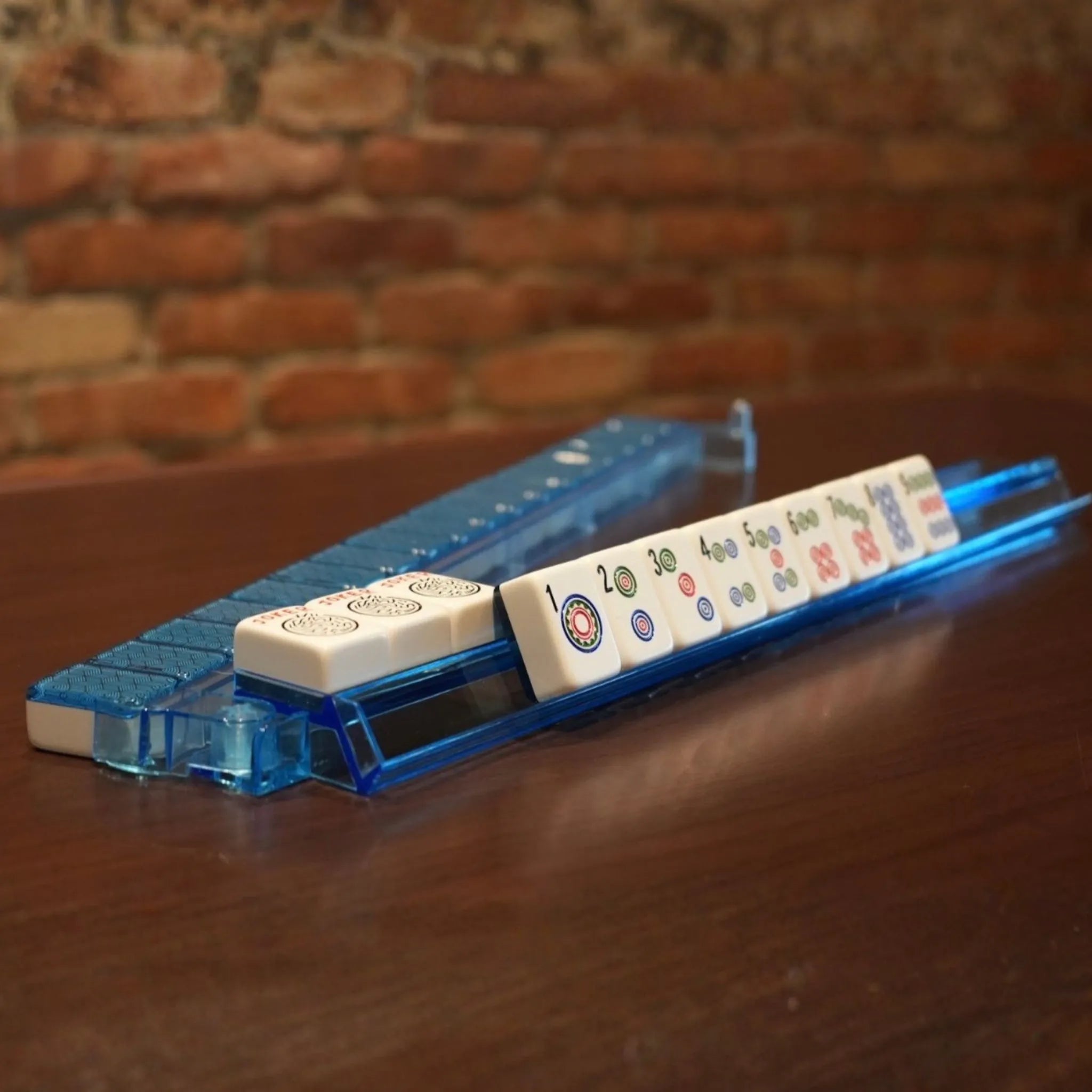 Side view of blue translucent acrylic Mah Jongg rack and pusher