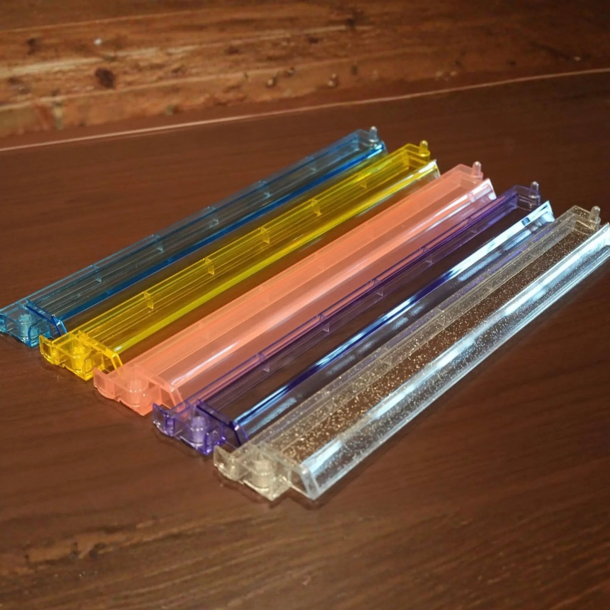 Clear acrylic mah jongg racks and pushers in multiple colors
