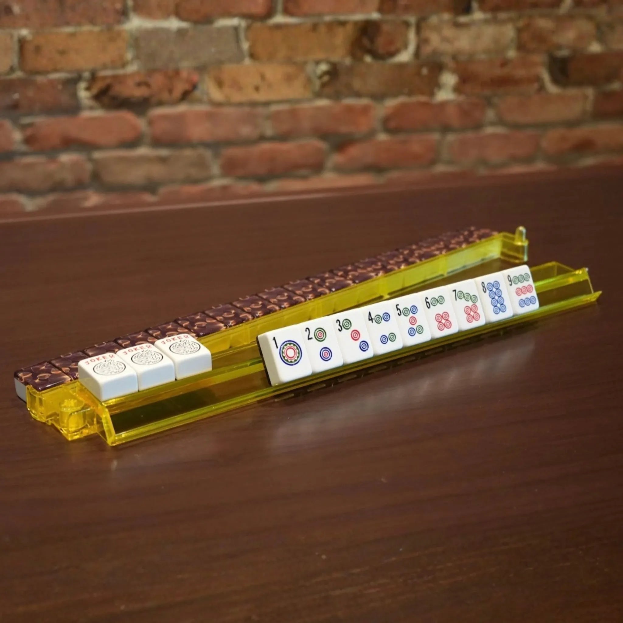 Close-up of yellow translucent acrylic Mah Jongg rack and pusher