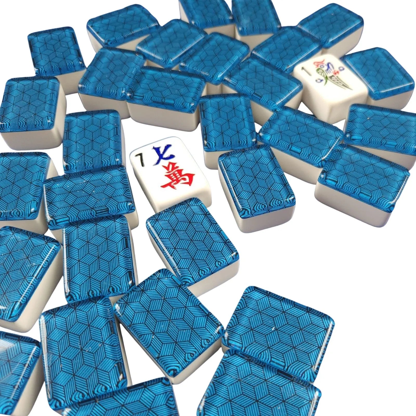 A pile of Mahjong tiles on a white background, showing blue patterned backs and several white face-up tiles with Chinese characters and a floral symbol.