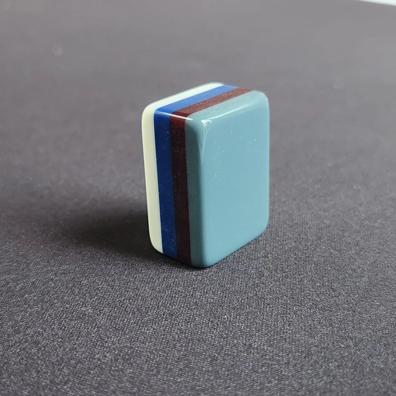Side profile of Earl Grey 30MM American Mah Jongg tiles showing grey backs and white faces