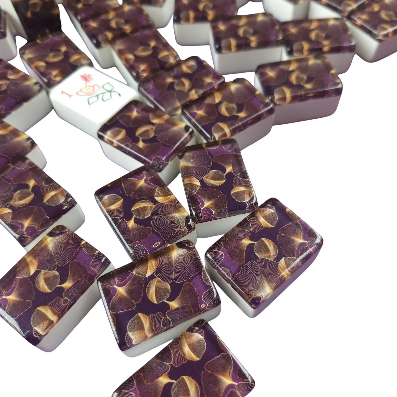 Set of purple and gold dominoes on a white background
