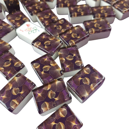 Set of purple and gold dominoes on a white background
