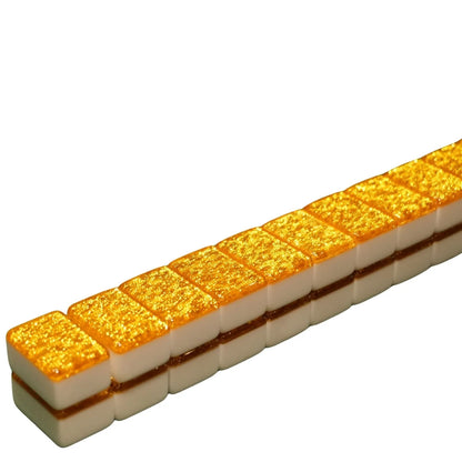 Row of gold and white rectangular tiles on a white background