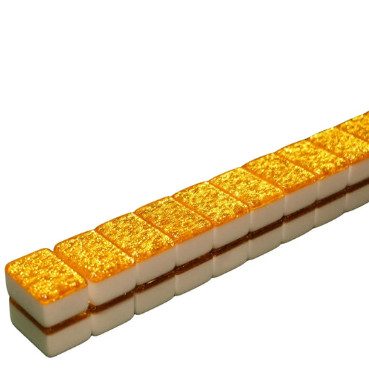 Row of gold and white rectangular tiles on a white background