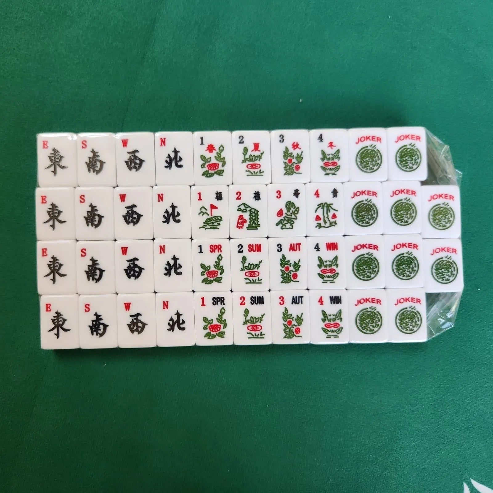 Jade 30MM American Mah Jongg winds flowers jokers and specialty tiles arranged in rows