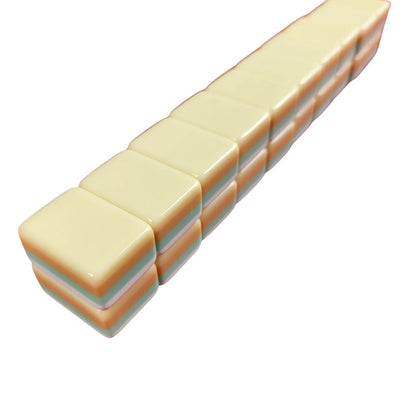 Side profile of Lemon Sherbet 30MM American mah jongg tiles with layered lemon, mint green, white, and peach edges