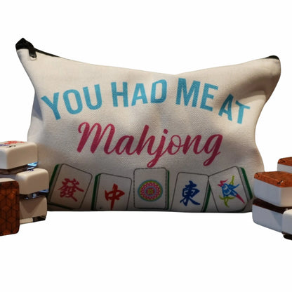 Canvas bag with 'You Had Me At Mahjong' text and mahjong tiles design, with actual mahjong tiles on sides.