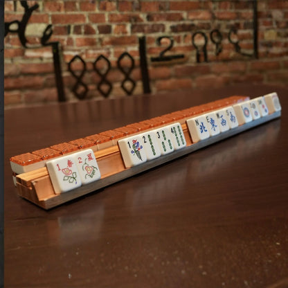 Metropolitan copper 36mm automatic mahjong tiles arranged on a wooden rack
