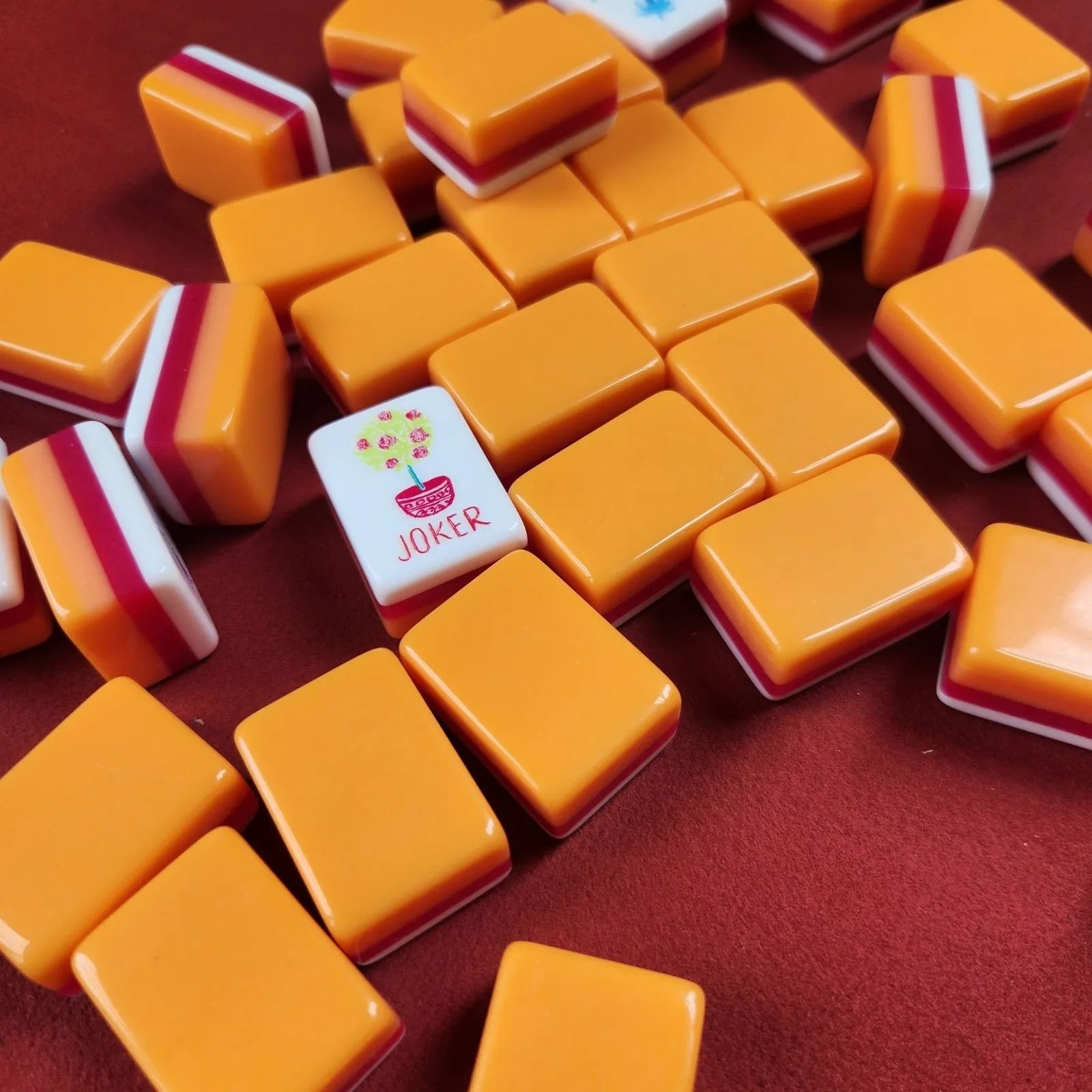 Orange Marmalade 30MM American Mah Jongg tiles displayed on a game table