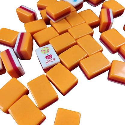 Orange Marmalade 30MM American mah jongg tiles with white backs and Joker tile displayed