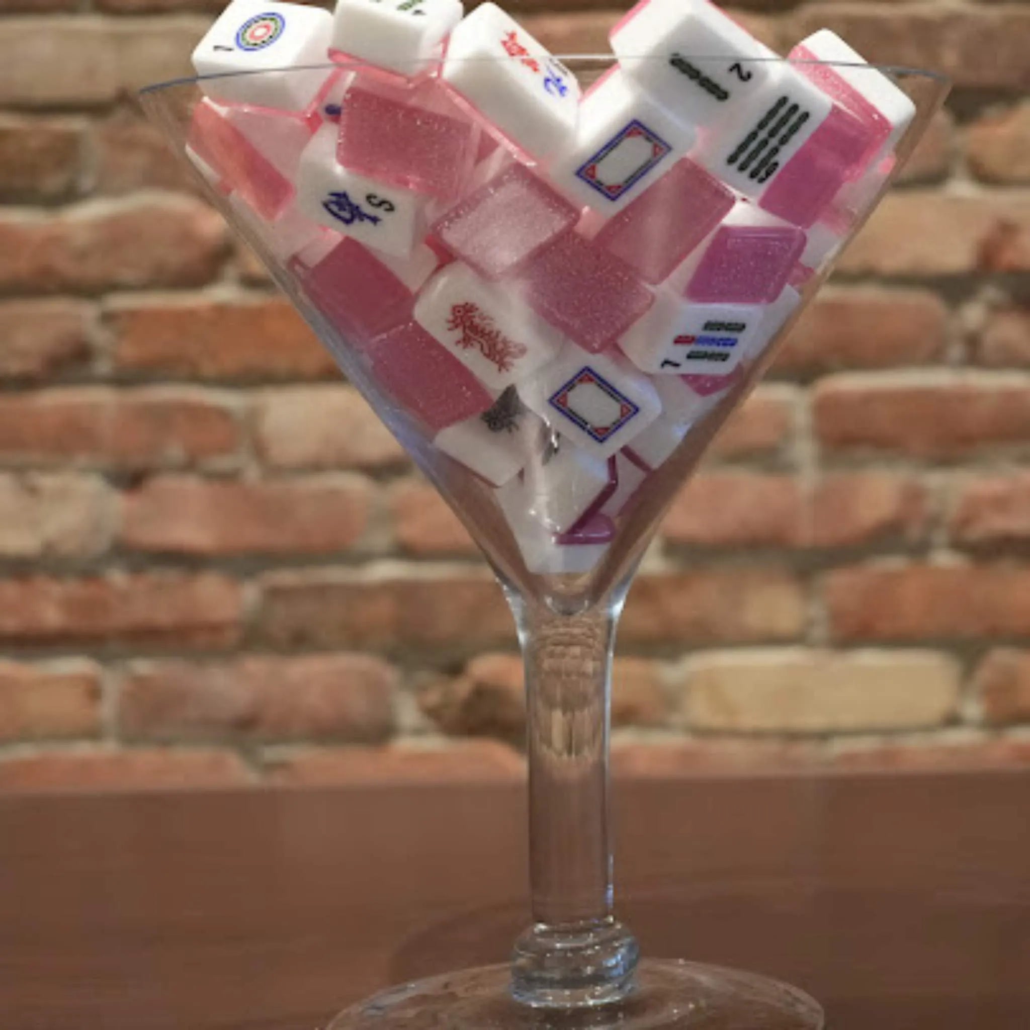 Pink sparkle 36mm automatic Mah Jongg tiles displayed in a martini glass