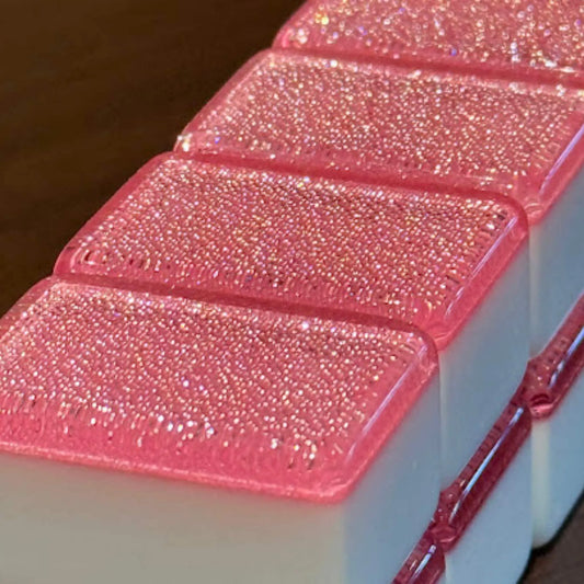 Stacked row of pink sparkle 36mm automatic mahjong tiles showing glitter faces
