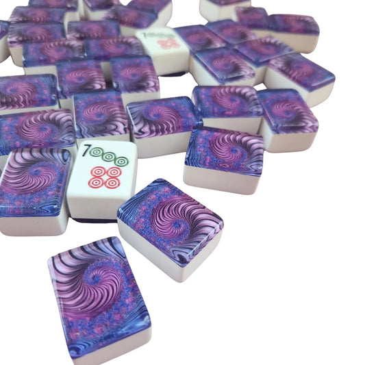 A pile of Mahjong tiles with a purple and blue psychedelic spiral pattern on a clean white background.