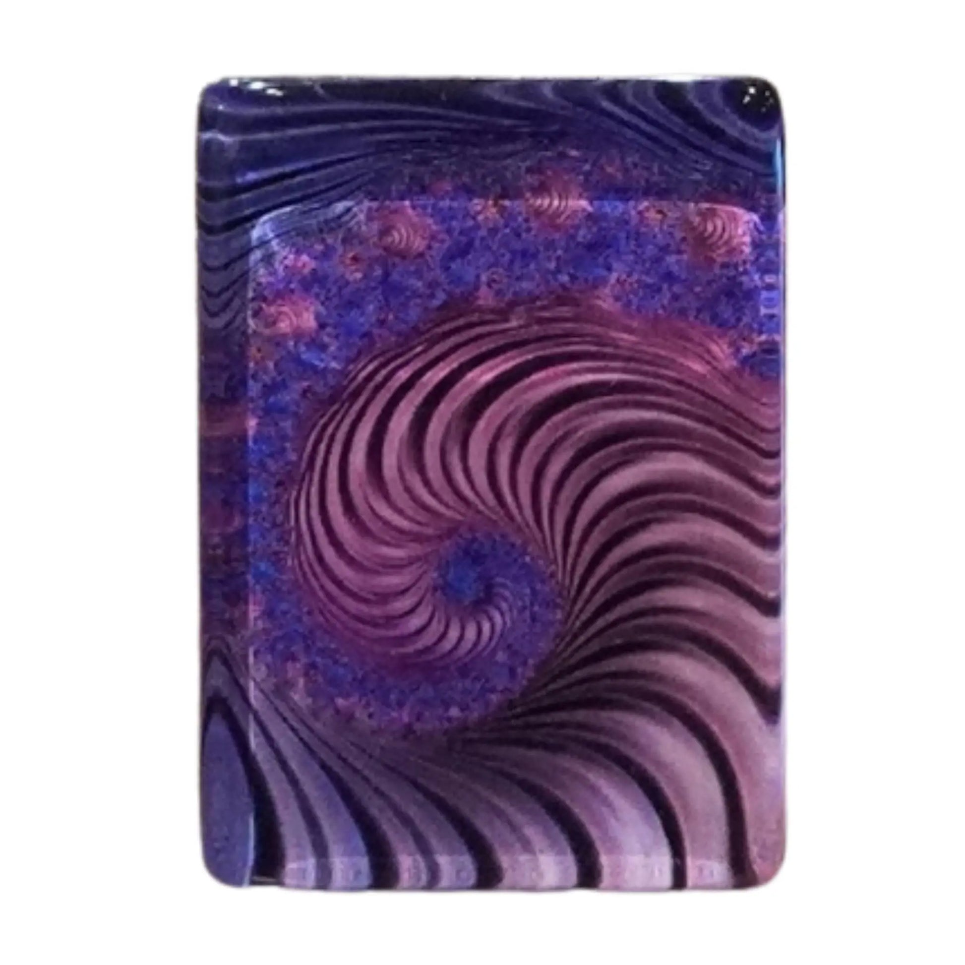 Close up macro shot of a single purple swirl mah jongg tile showing the intricate spiral design on the back.