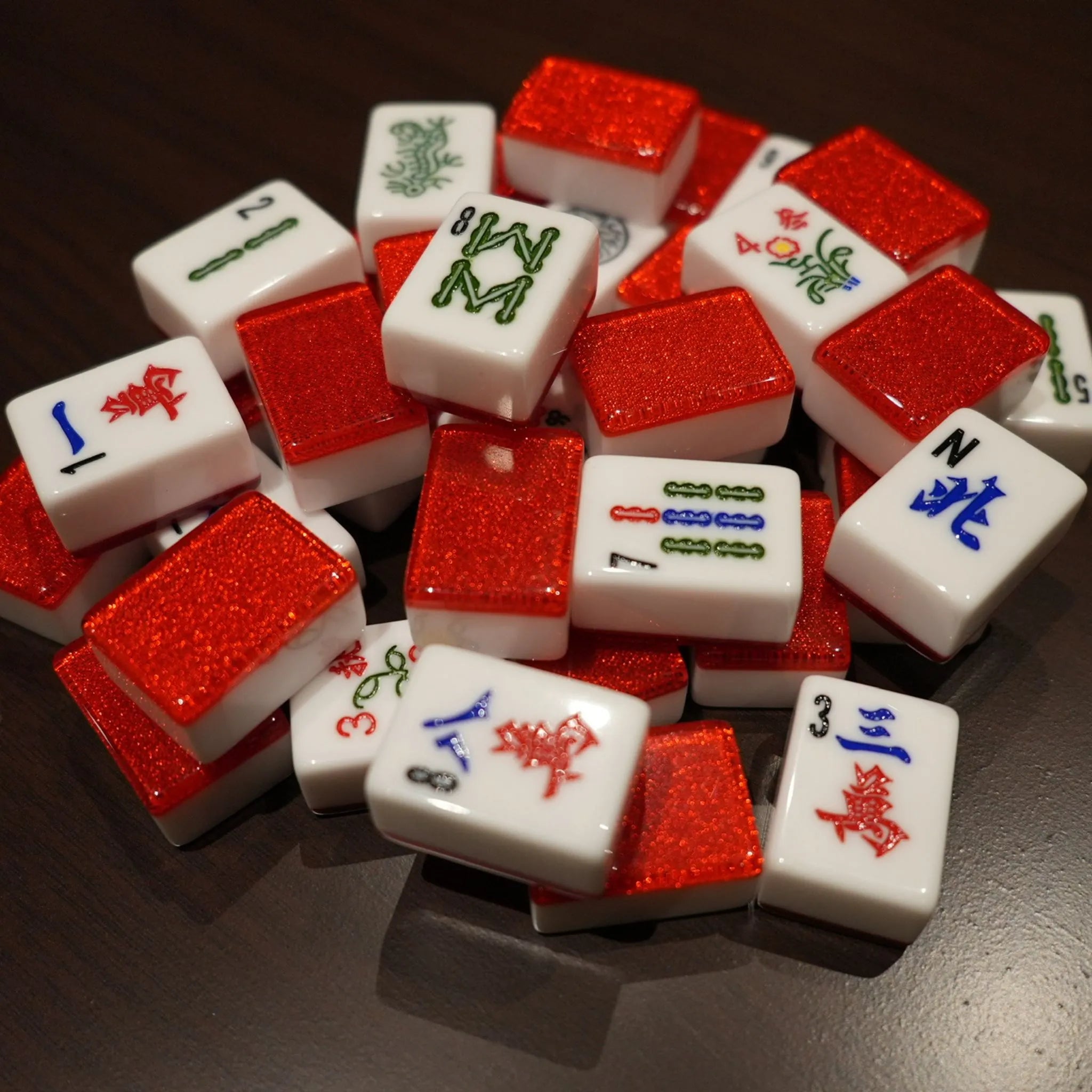 Red Sparkle 36MM automatic Mah Jongg tiles piled together