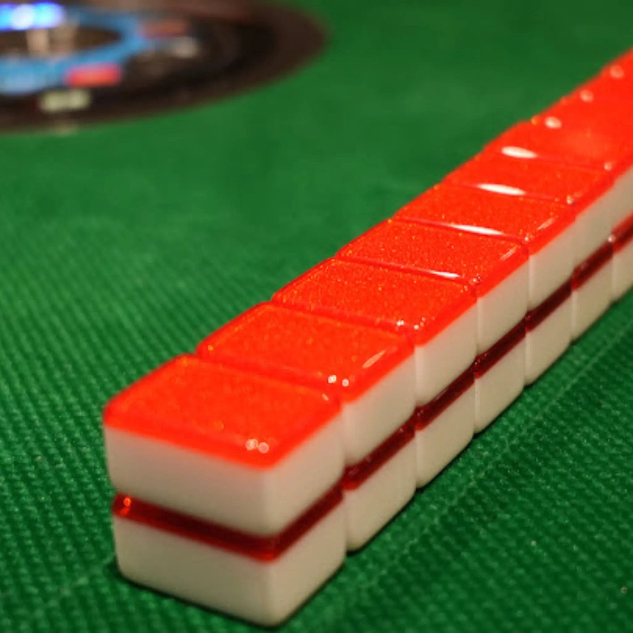 Red Sparkle 36MM automatic Mah Jongg tiles stacked in a row