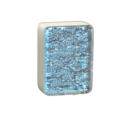 Single silver sparkle 36mm automatic mahjong tile with glitter face on wooden surface
