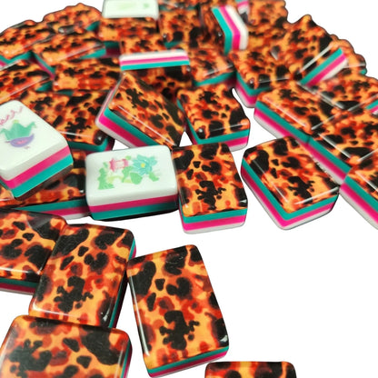 Side profile of Tortoise Shell 30MM American mah jongg tiles with layered turquoise, white, pink, and green edges